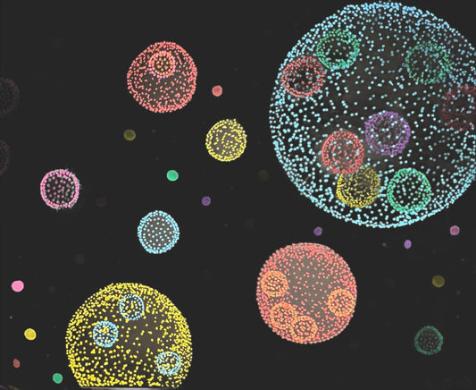 Different colored spheres made of dots represent ancient cell colonies.